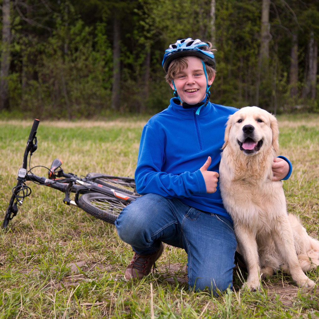 Dog and boy with bike
